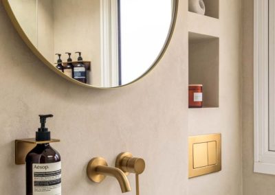 Microcement bathroom using Forcrete in a yellow-grey tone.